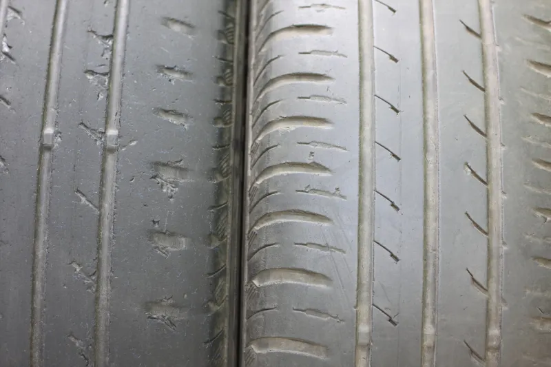 old summer tires with various damages closeup