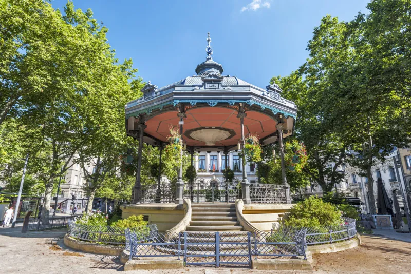 saint-etienne, france - july 29, 2019 the bandstand is in the square of jean jaures in saint etienne downtown the city hall building is at background