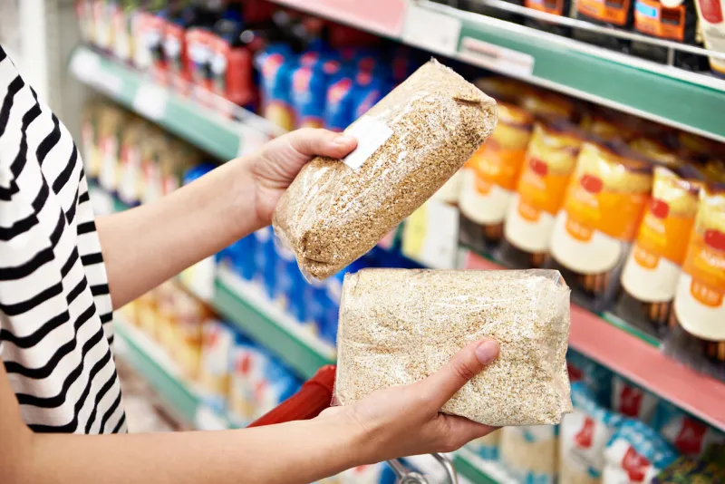 buckwheat and barley groats in the hands of the buyer