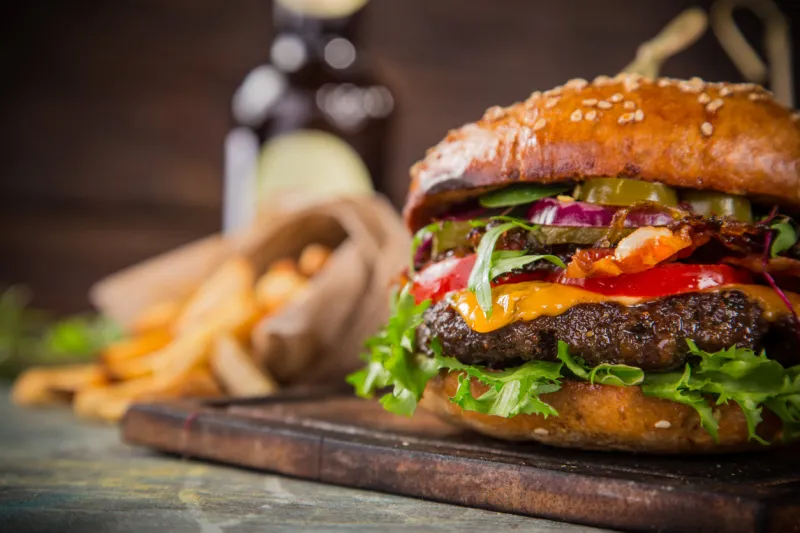 close-up of home made tasty burgers on wooden table
