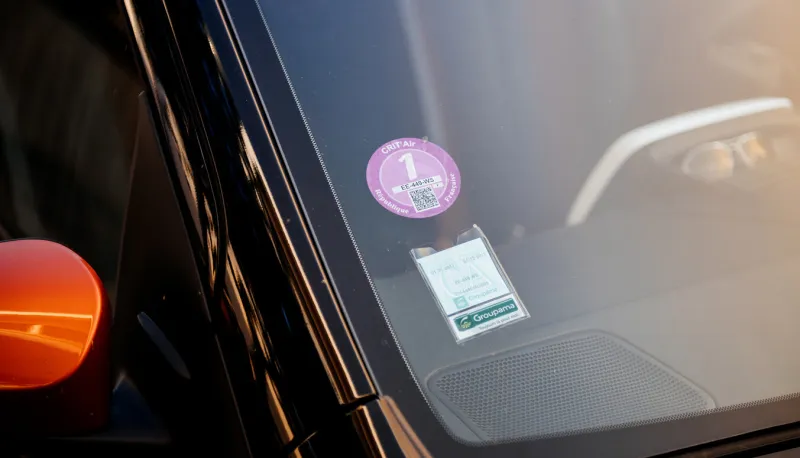 strasbourg  mandatory air quality certificate crit'air certifying the vehicle's environmental class based on pollutant emissions - sticker on windshield