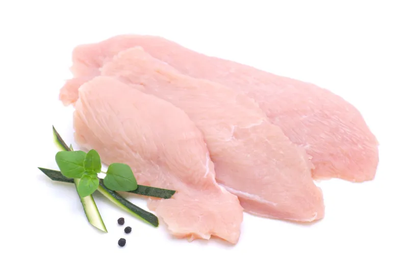 three slices of skinless boneless chicken breast and spices