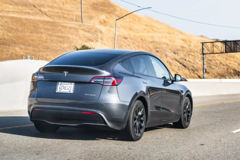 july 26, 2020 fremont   ca   usa - tesla model y travelling on the freeway in silicon valley, east san francisco bay area