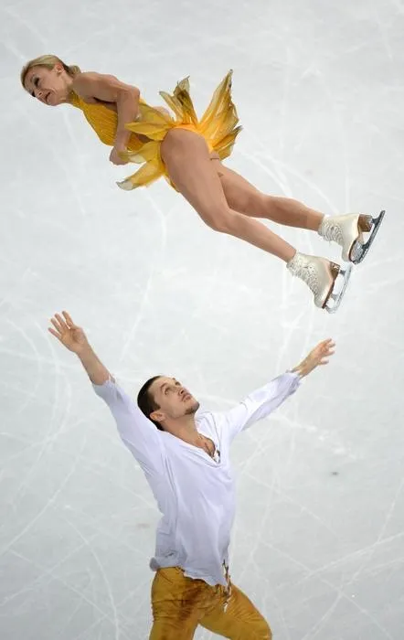 russia's tatiana volosozhar and russia's maxim trankov perform their figure skating pairs free program at the iceberg skating palace during the sochi winter olympics on february 12, 2014 afp photo   yuri kadobnov   afp photo   yuri kadobnov