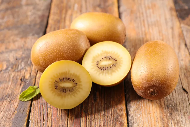 yellow kiwi on wood background