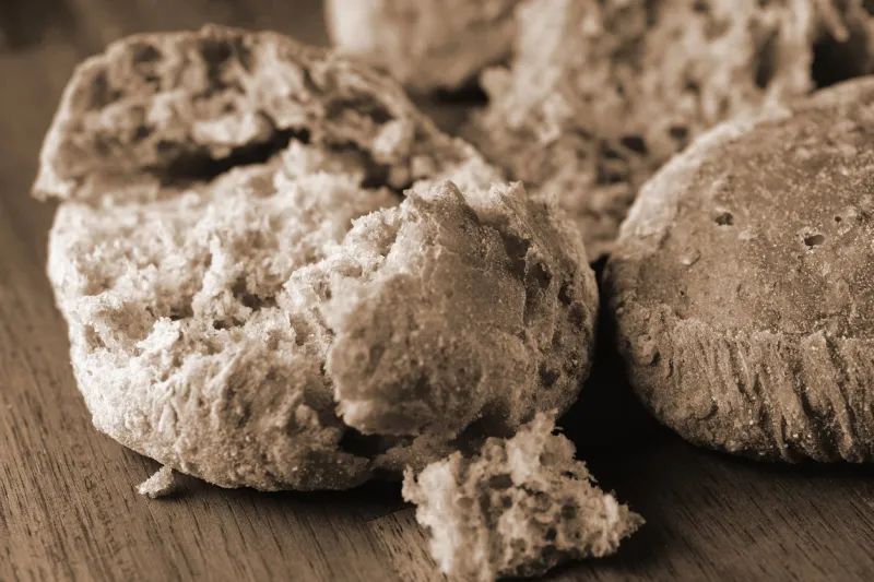 freshly baked bread rolls toned monochrome close up image with rustic style