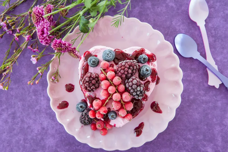 ice cream in a heart-shape with berries