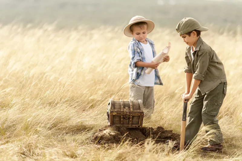 two boys have unearthed a treasure in the thick prairie grass