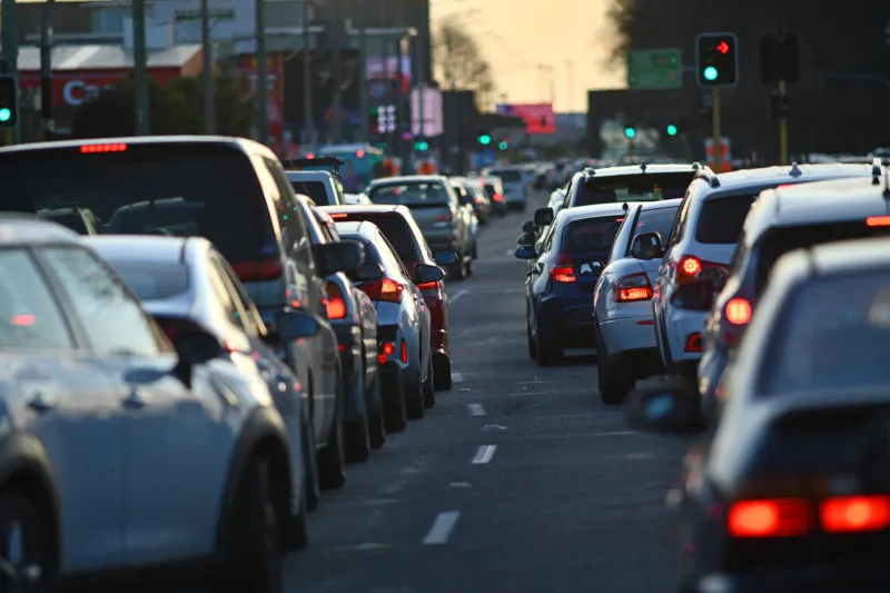 vehicles line up in peak hour traffic on moorhouse avenue in christchurch, new zealand