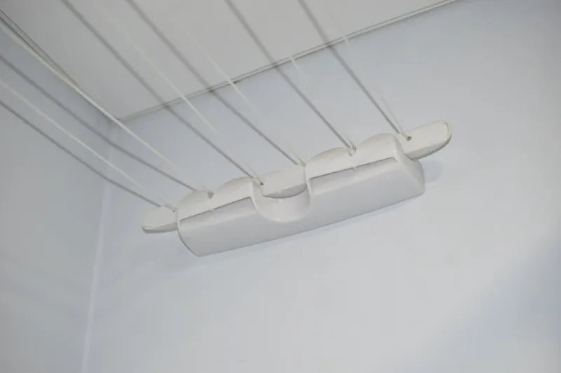 laundry rack on ropes in the bathroom under the ceiling