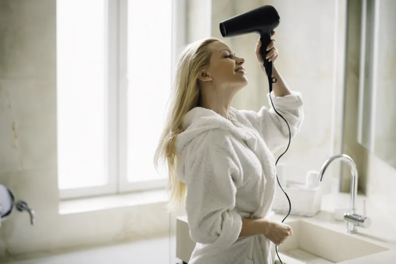 beautiful woman in bathrobe enjoying in hotel young woman relaxing in room