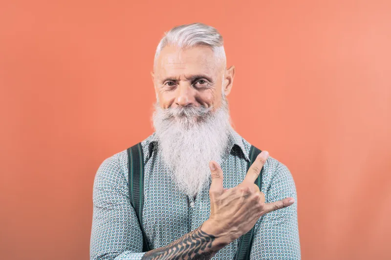 senior man having fun posing in front camera - happy mature male enjoying retired time - elderly people lifestyle and hipster culture concept