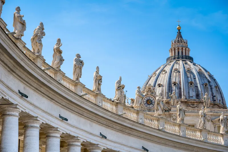 a majestic view of bernini's colonnade in the square of st peter's basilica in rome