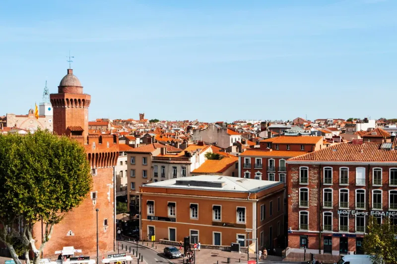 perpignan, france - september 14, 2019  aerial view of the old town of perpignan, france, highlighting on the left le castillet bastion, an iconic landmark in the city, built on the fourteenth century
