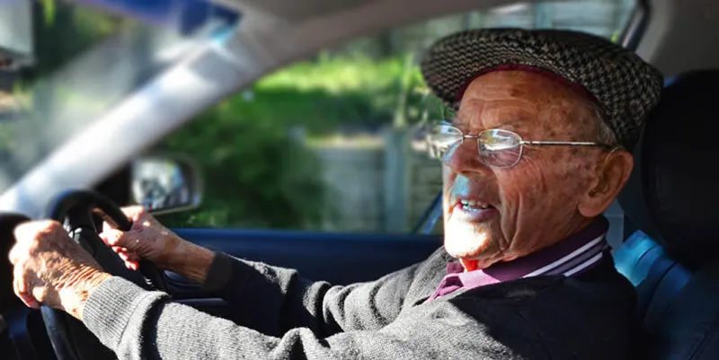 a very old man with a valid driving license drives a car
