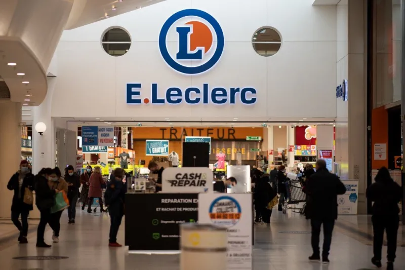 people come and go at the entrance of a french retail surpermarket e leclerc, on january 13, 2021 in saint-herblain, outside the city of nantes (photo by loic venance   afp)