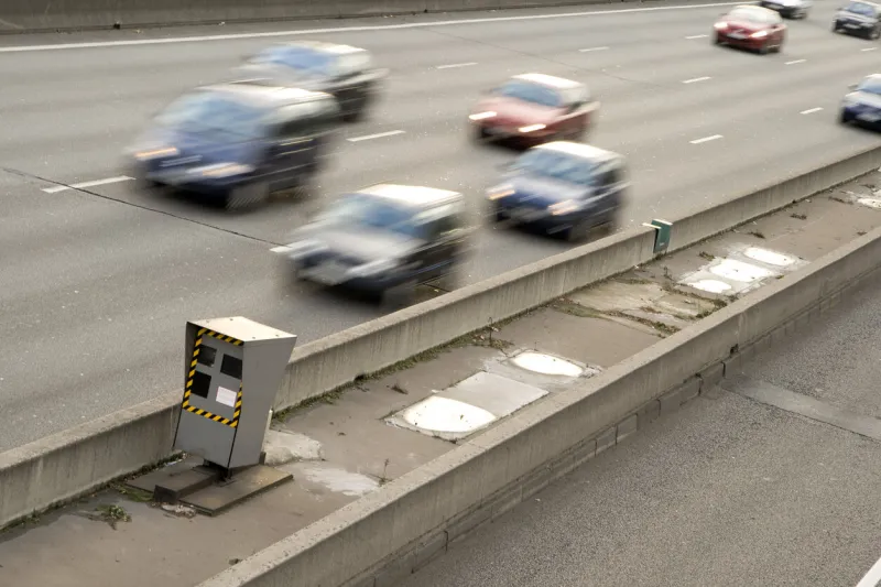 cars passing in front of a speed control radar on the freeway