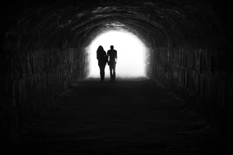 couple and light in the end of the tunnel hope and freedom