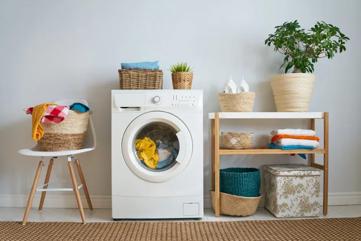 interior of a real laundry room with a washing machine at home