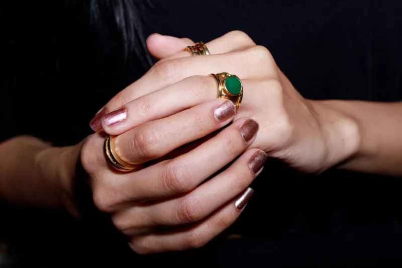 woman's hands with jewelry rings