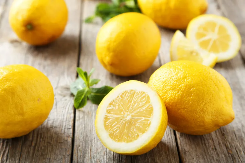 lemons on grey wooden background