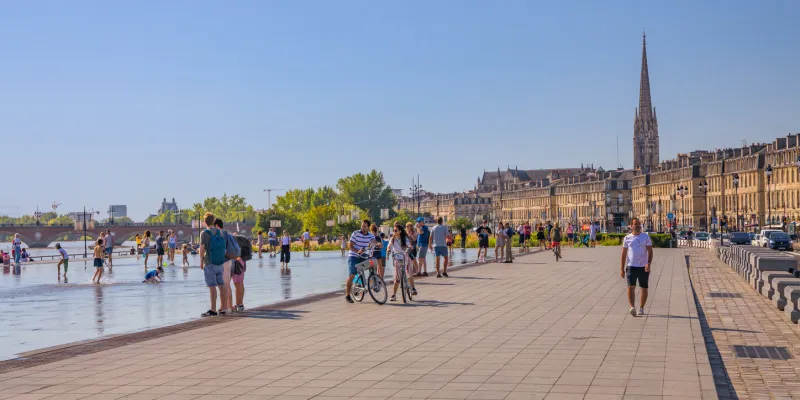 place de la bourse and its mirroir d'eau (water mirror) with the saint-michel church in the background
