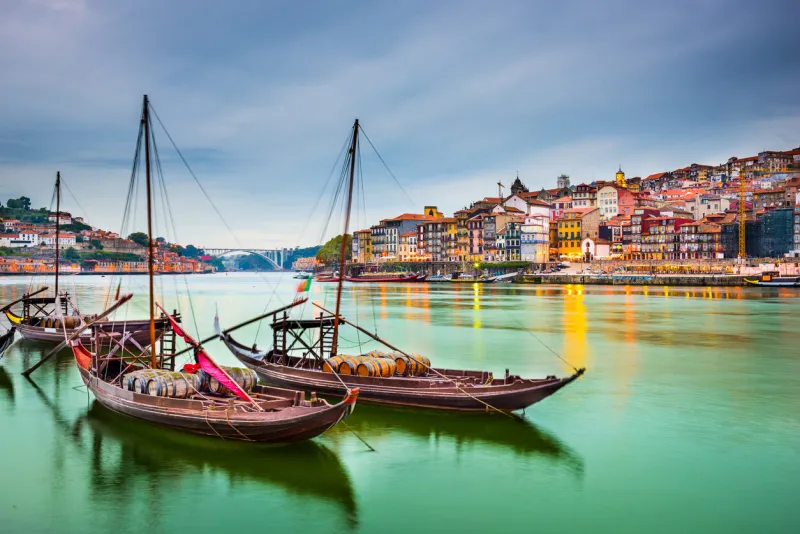 porto, portugal old town cityscape on the douro river with traditional rabelo boats