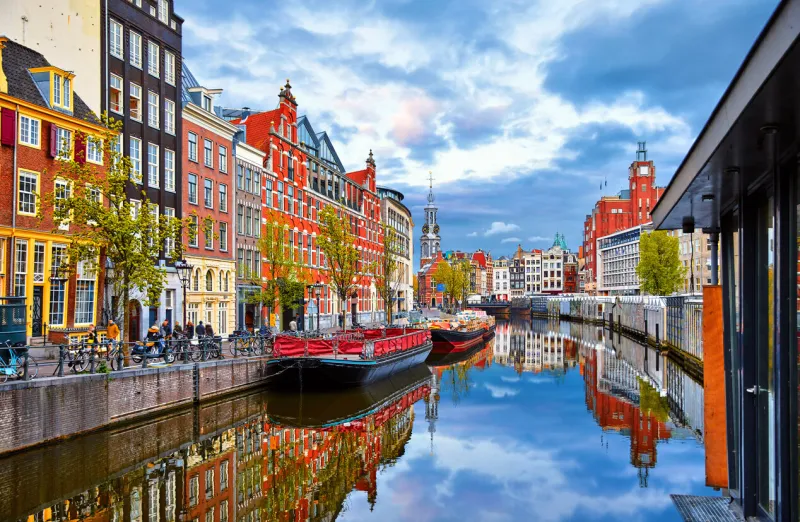 channel in amsterdam netherlands houses river amstel landmark old european city spring landscape