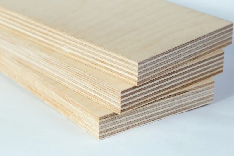 the three light plywood boards stacked, macro