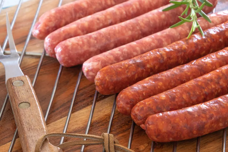 merguez and raw sausages on a plate