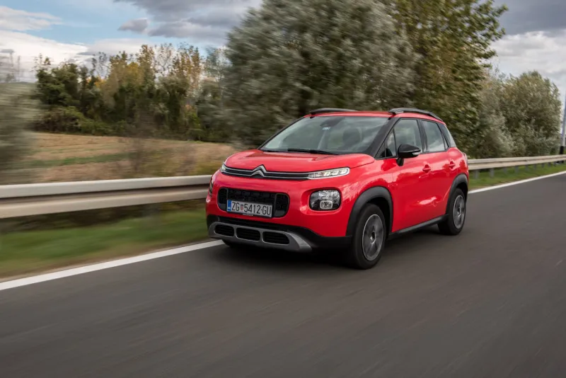 new red citroen c3 aircross 2018 model exterior of the car brand new citroen on the city streets moving car