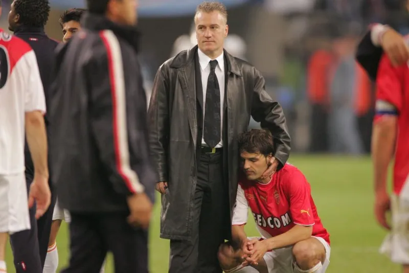 as monaco coach didier deschamps and player fernando morientes pictured after the soccer champions league final as monaco-fc porto (0-3) in gelsenkirchen-germany on wednedsday, may 26, 2004 photo by nebinger-zabulon abaca