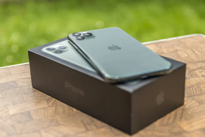 portland, oregon   usa - october 2019 iphone 11 pro max midnight green laying on its box