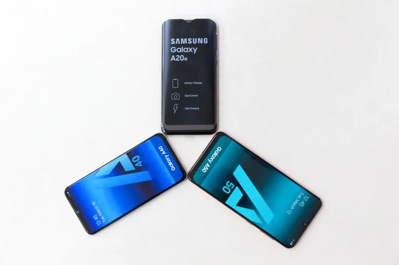 belgrade, serbia - jun 06, 2019  three new samsung galaxy a20e, a40 and a50 mobile cellphones are displayed on isolated white background