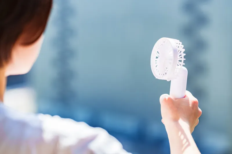 japanese woman has a handy fan in summer