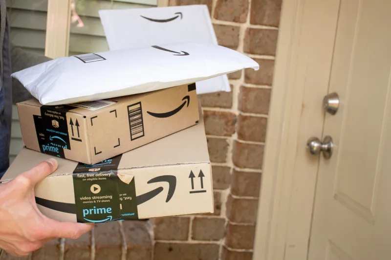 sydney, australia - 2020-10-17 amazon prime boxes and envelopes delivered to a front door of residential building