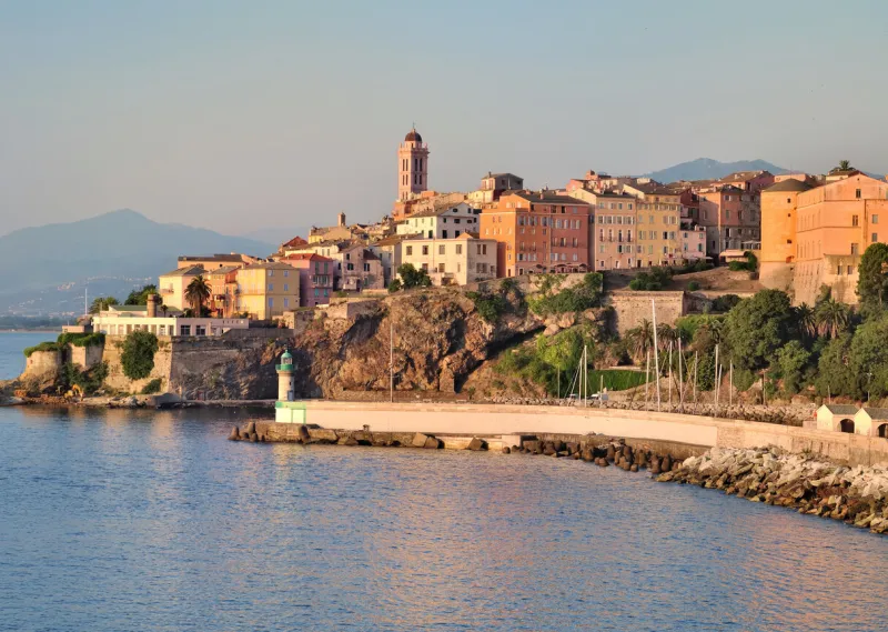 houses and buildings in the city of bastia with beautiful colors of dusk