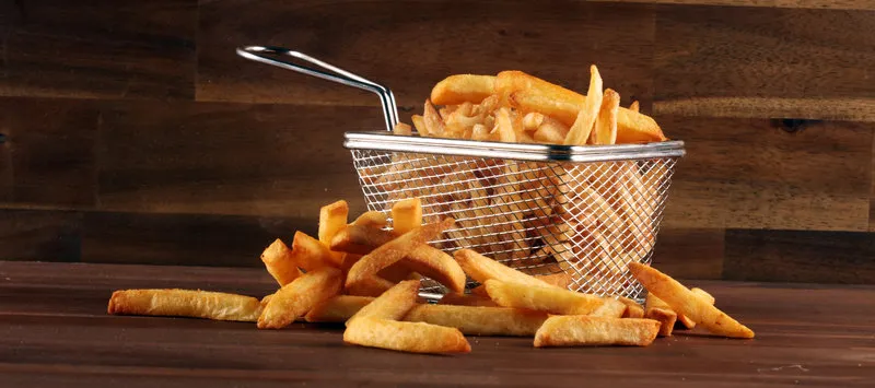 tasty french fries on wooden table background fresh pommes frites