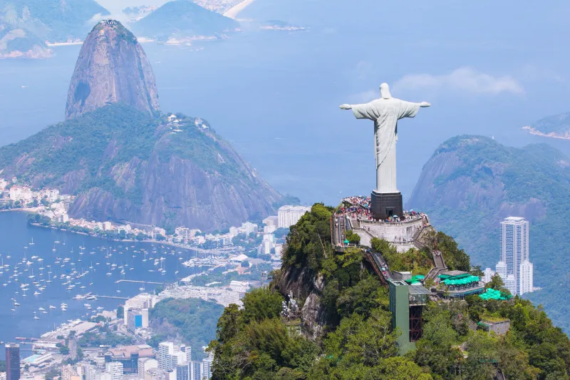 rio de janeiro, brazil - december 28, 2013  aerial view from a helicopter of rio de janeiro with the corcovado mountain and the statue of christ the redeemer with sugarloaf mountain in the background
