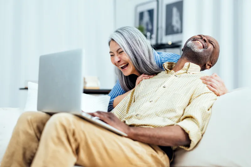 cinematic image of an happy multiethnic senior couple indoors lifestyle moments at home concept about seniority and relationships