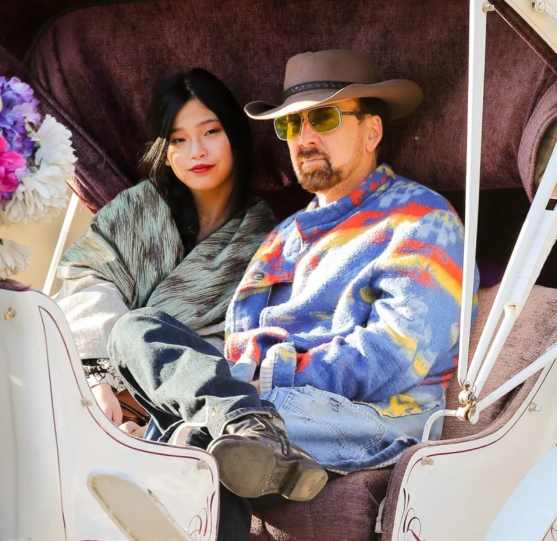 exclusive - nicolas cage and girlfriend take a horse carriage ride - nyc