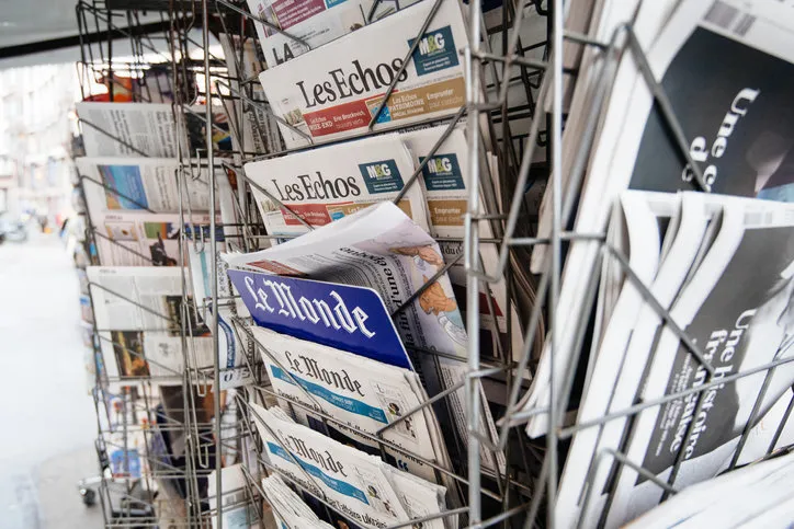 paris, france - sep 27, 2019  street view of stand with le monde, les echo and other french international newspaper titles covers at press kiosk stand