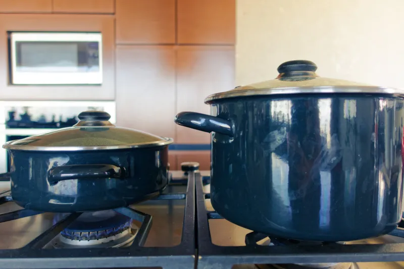 cooking vegetables (carrot, onion, tomatoes, paprika) and meat at home