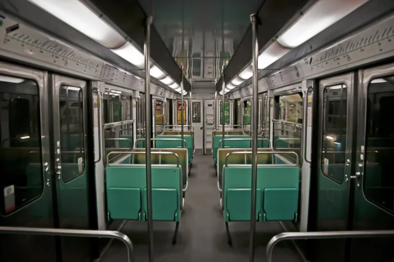 an empty paris metro carriage in the early morning