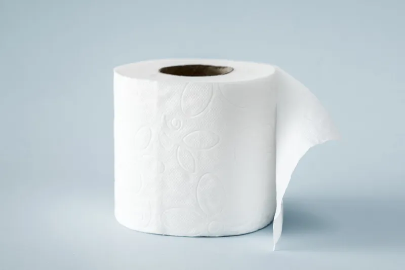 white roll toilet paper on the light blue background