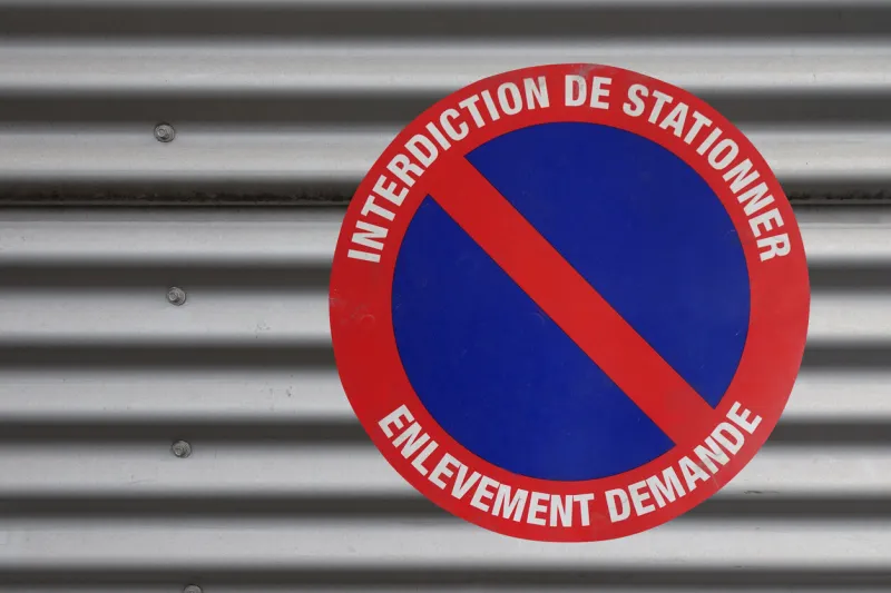 prohibition of parking road signs placed on a car garage door