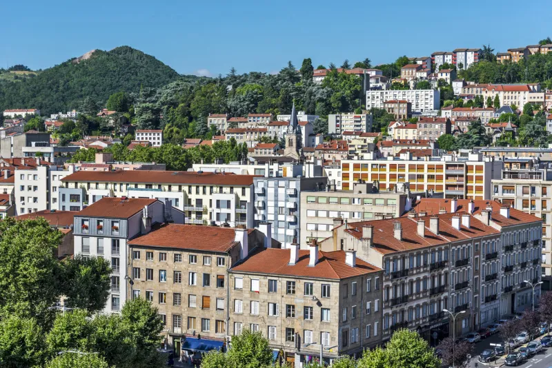 saint-etienne, france - july 29, 2019 saint etienne cityscape as seen from the tower of cite du design in western direction the montaud hill is at background