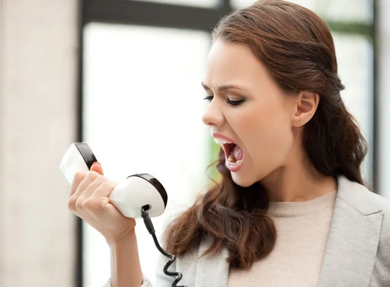 picture of angry businesswoman shouting at phone