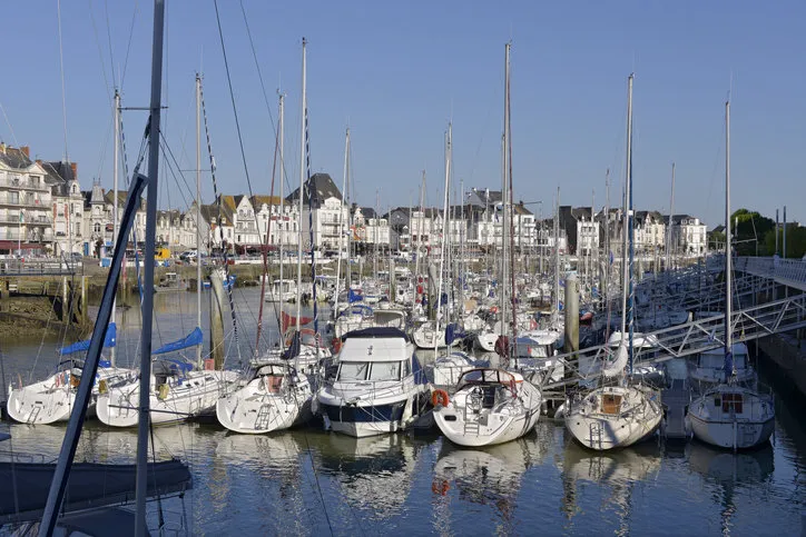 port of la baule escoublac with le pouliguen in the background la baule escoublac is a commune in the loire-atlantique department in western france is a famous seaside resort on the côte d'amour