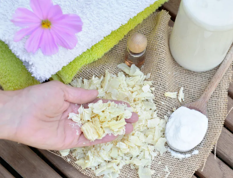 pieces of soap in a hand of a woman to homemade laundry